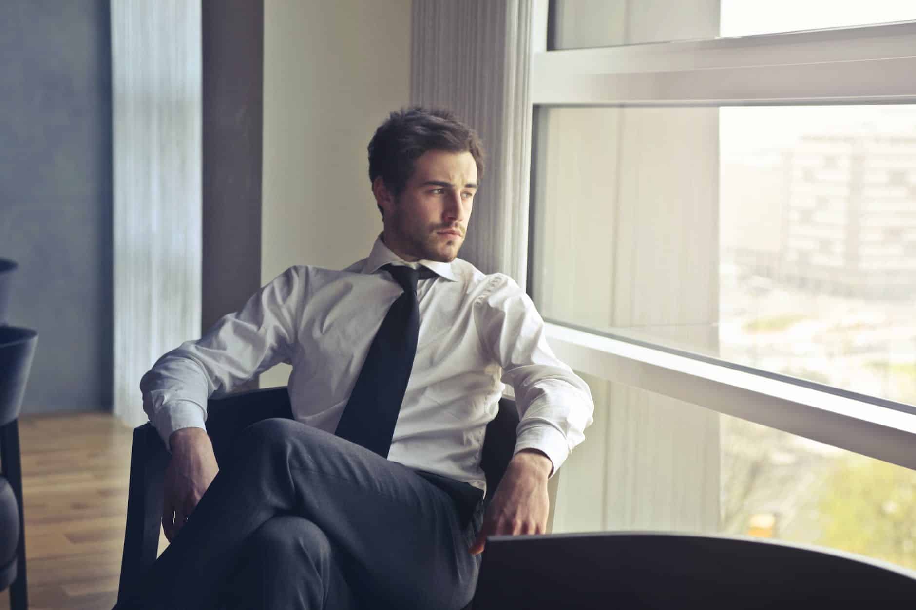 man wearing white dress shirt and black necktie showing entrepreneurial character traits