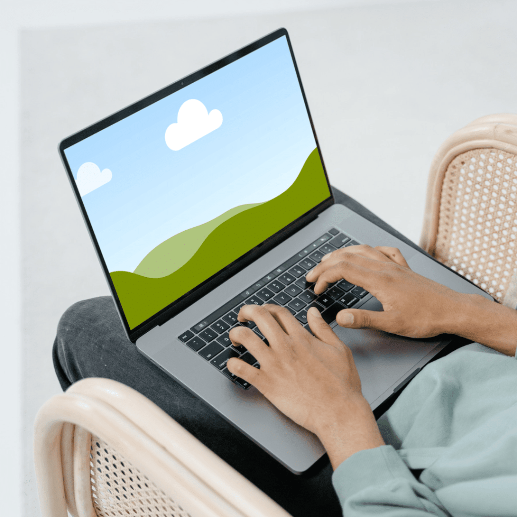 Canva mock up working on laptop