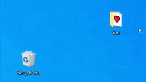 Animated GIF of a desktop screen with a folder labeled 'You' featuring a heart icon, next to a Recycle Bin on a blue background.