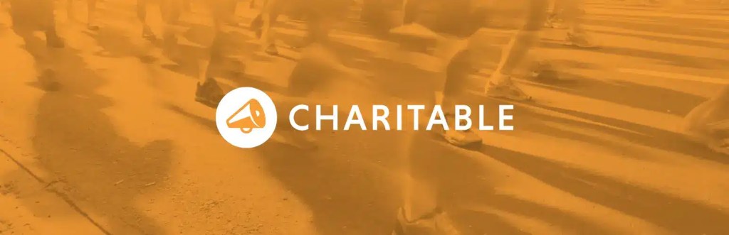 Logo of Charitable donation plugin with an orange background featuring blurred images of people running.